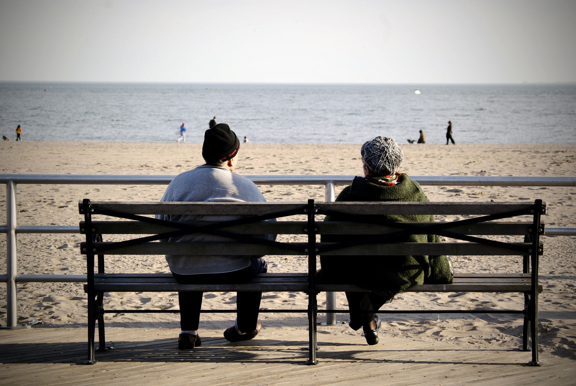 An old couple looking at the Ocean.